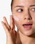 Zestaw: regulujący krem SPF 50 i wyciszające serum